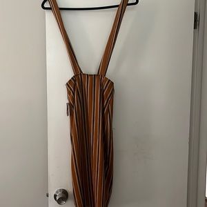 Brown, with black and white skirt